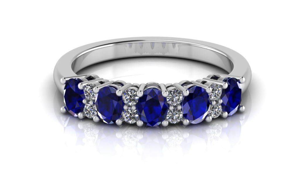 White gold ceylon sapphire band with diamond accents in-between