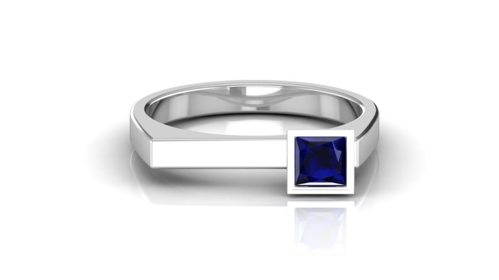 White gold ring featuring offset princess cut ceylon sapphire