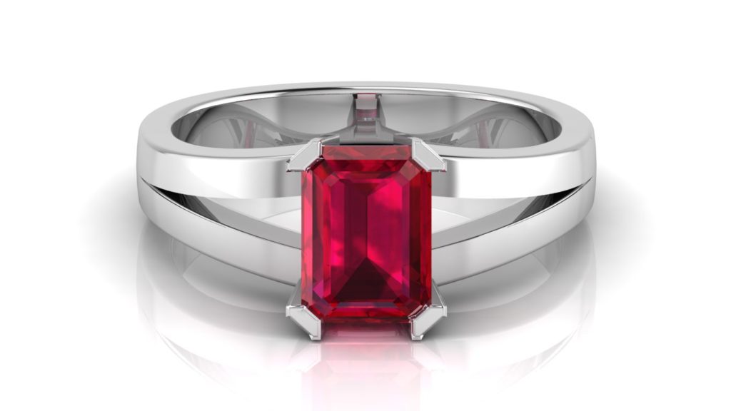 White gold split shank ring featuring an emerald cut ruby