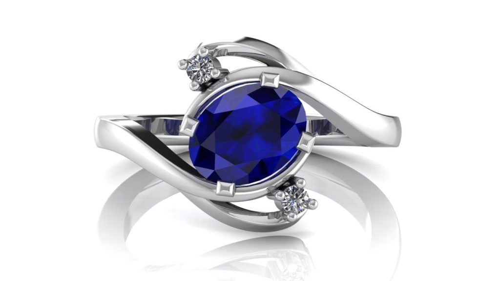 White gold abstract ring featuring an oval ceylon sapphire and diamond accents