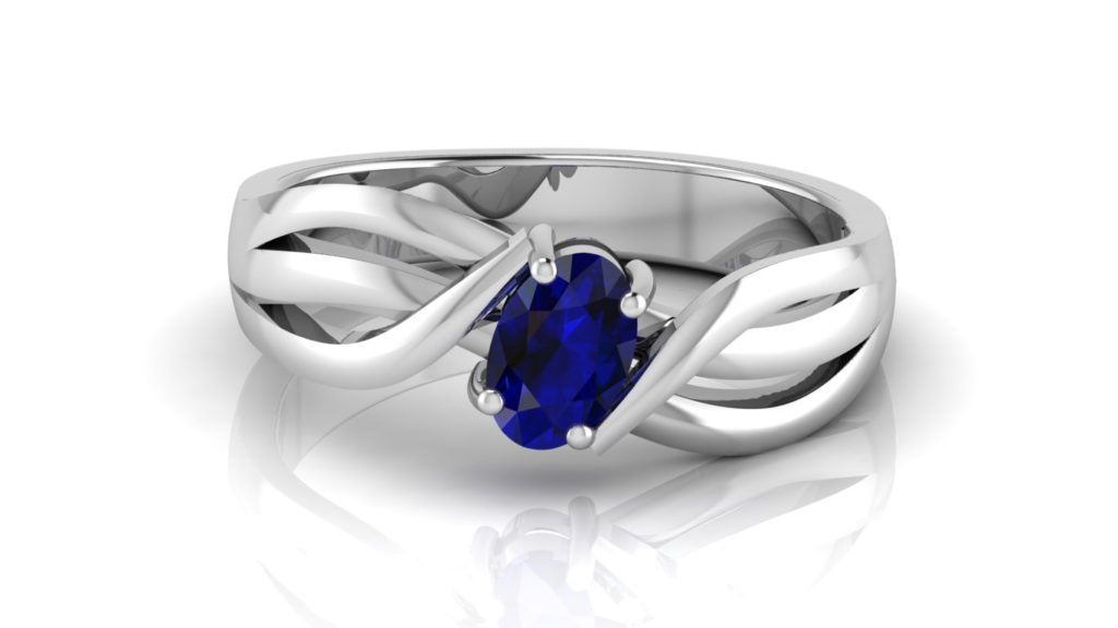 White gold abstract ring featuring an oval ceylon sapphire and diamond accents