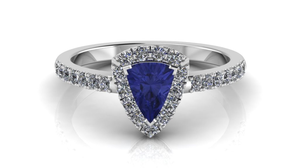 White gold halo ring featuring a trillion cut tanzanite and diamonds