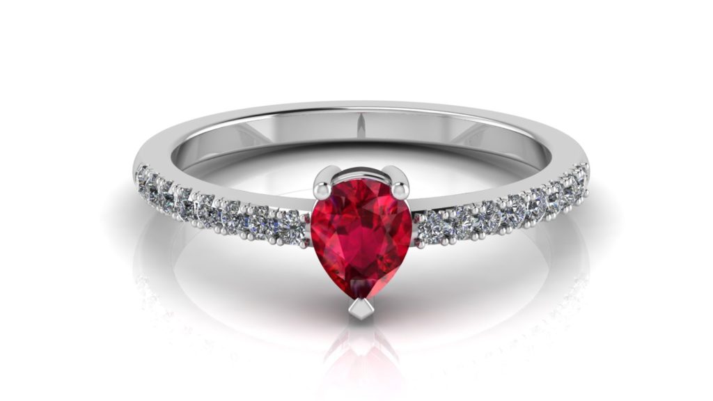 White gold ring featuring a pear cut ruby with diamonds