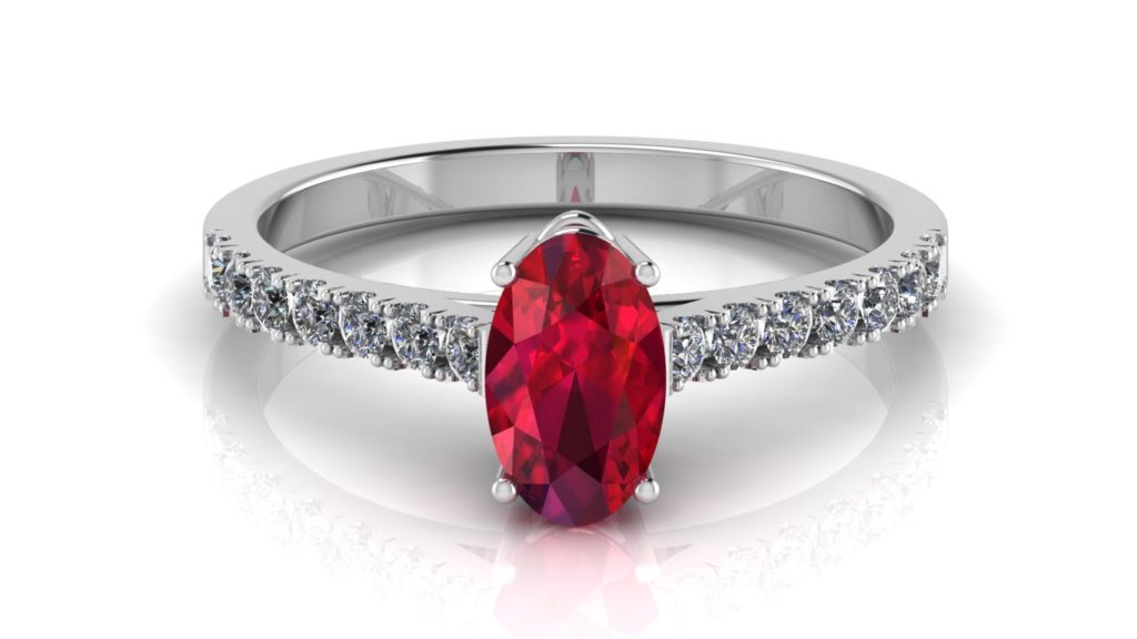 White gold ring featuring an oval ruby with diamonds