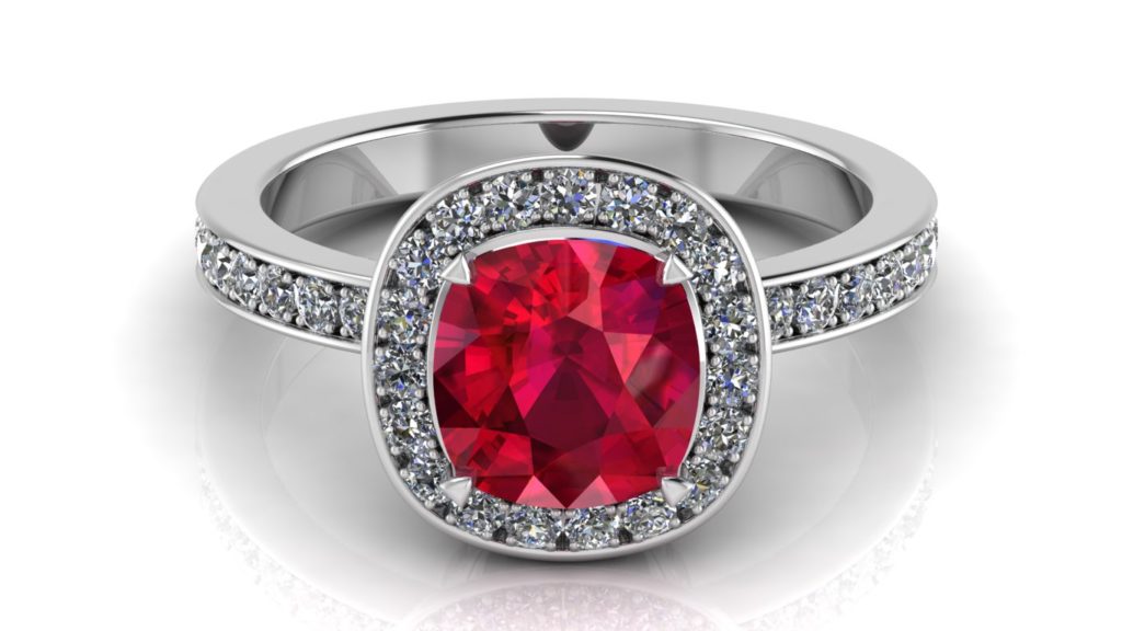 White gold halo ring featuring a cushion cut ruby and pave set diamonds