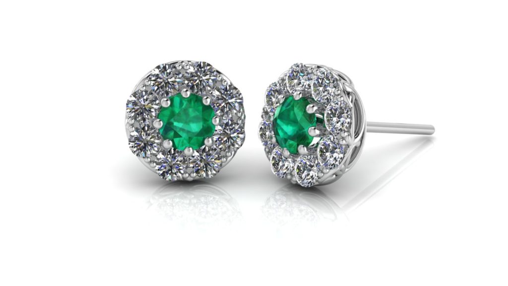 White gold halo studs featuring emerald and diamonds