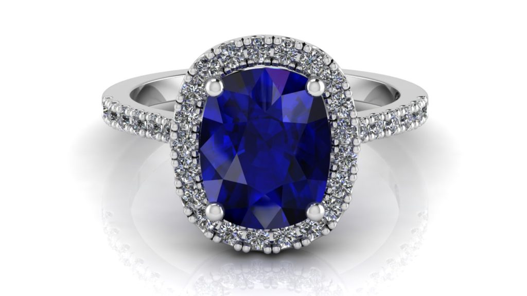 White gold halo engagement ring featuring a cushion cut ceylon sapphire with diamonds