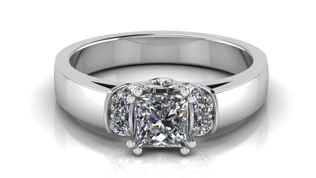 White gold engagement ring featuring a double claw set princess cut diamond with pave set diamond accent