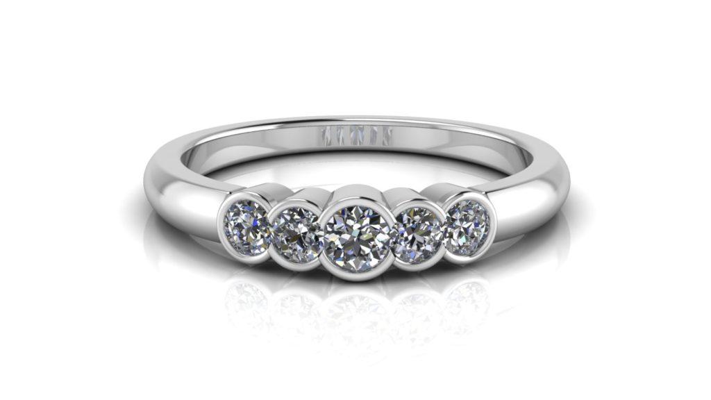 White gold ladies half bezel set ring featuring five diamonds