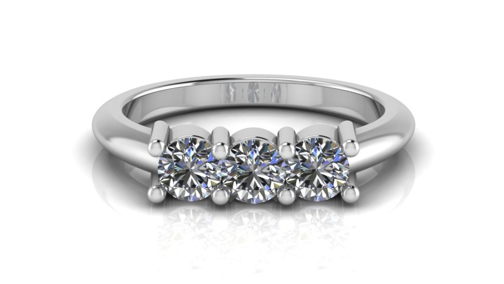 White gold three stone engagement ring featuring claw set round diamonds