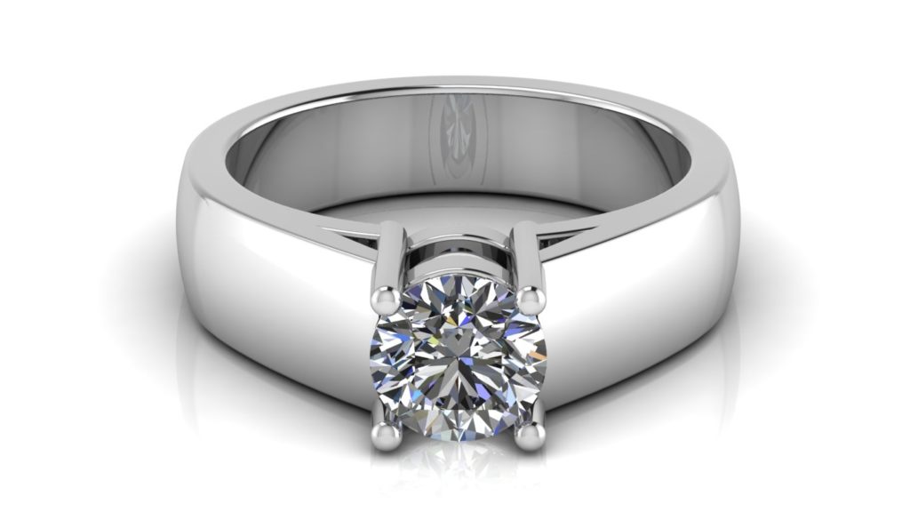 White gold solitaire engagement ring featuring a claw set round diamond