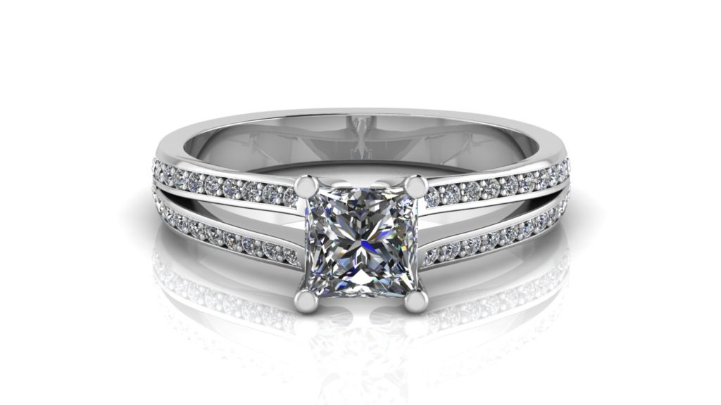 White gold split shank engagement ring featuring a princess cut diamond with pave set diamonds down the band