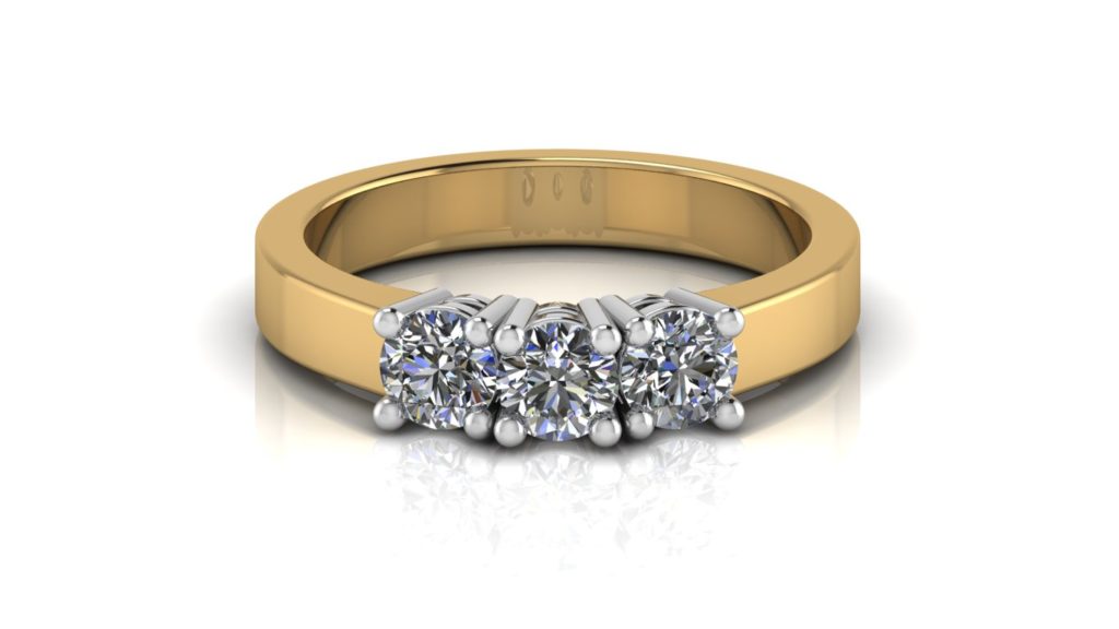 Yellow gold three stone diamond engagement ring