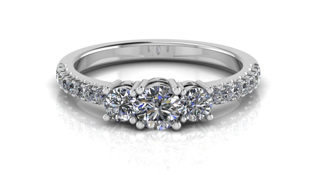 White gold three stone diamond engagement ring with accent diamonds down the band