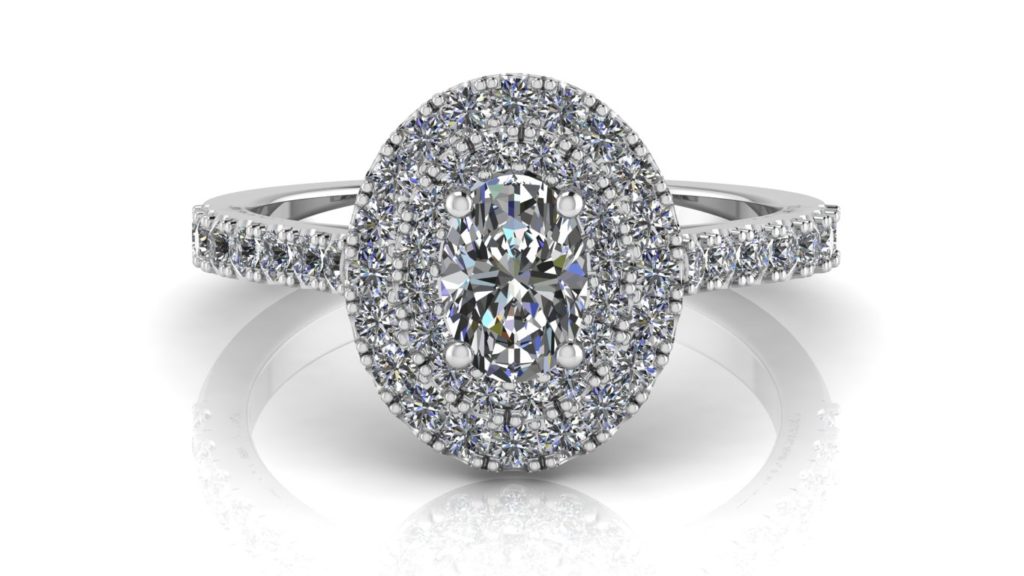 White gold double halo engagement ring featuring an oval cut diamond with smaller diamonds down the band