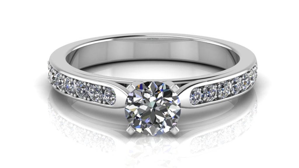 White gold engagement ring featuring a round diamond with pave set diamonds down the band