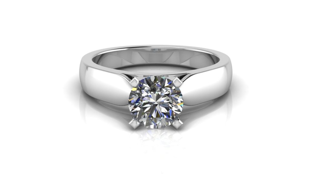 White gold solitaire engagement ring featuring a round diamond