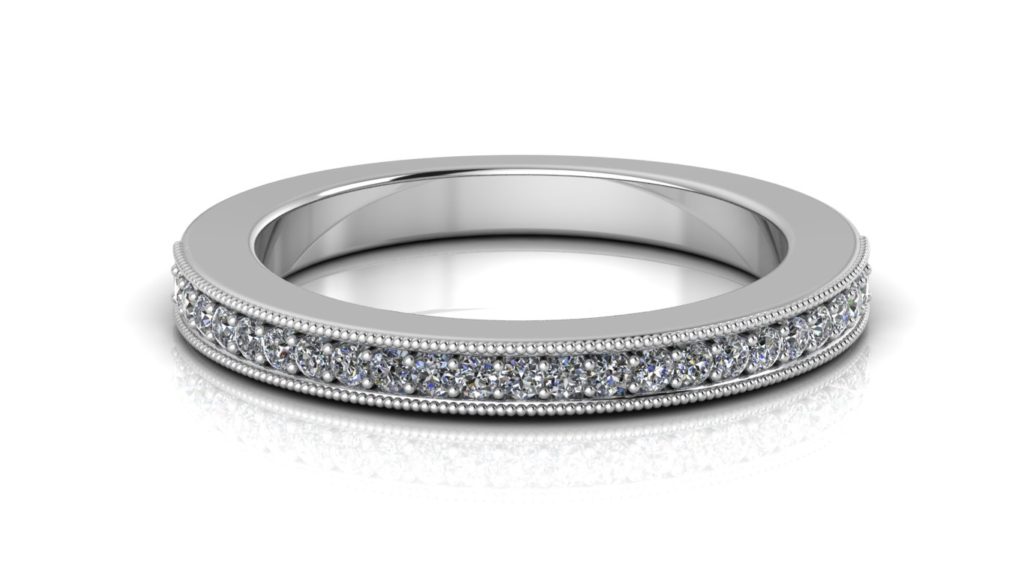 White gold ladies ring featuring pave set diamonds with milgrain accents