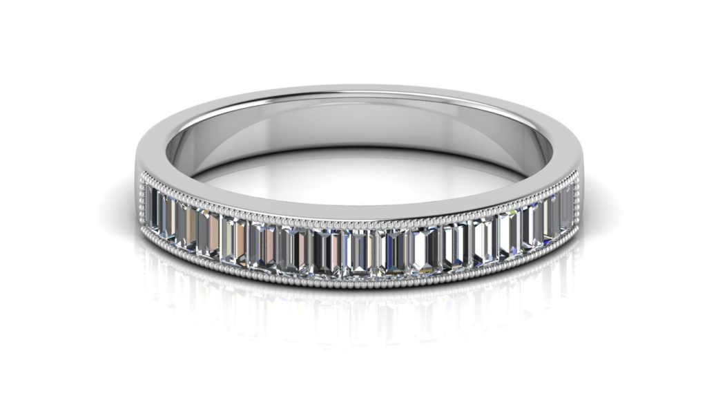 White gold ladies ring featuring channel set baguette diamonds with milgrain accents