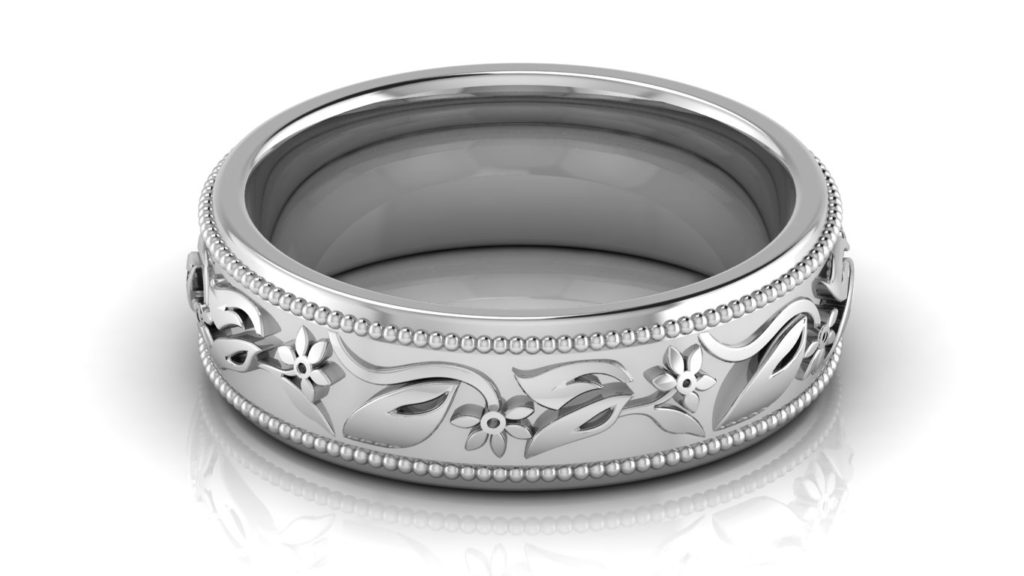 White gold ladies band with floral motif center and milgrain edges