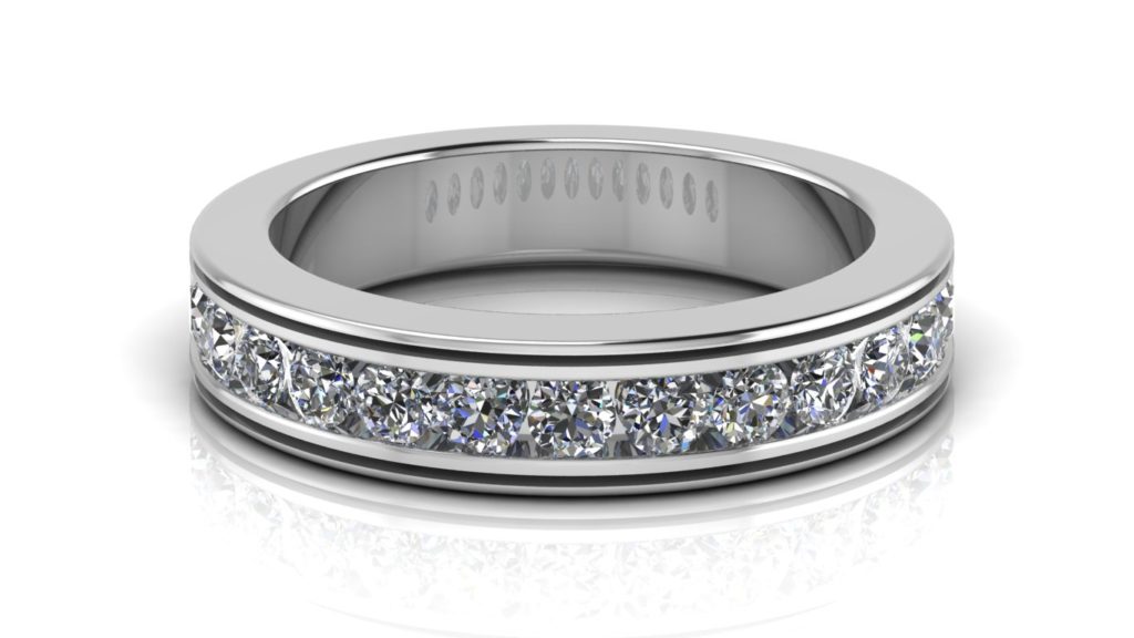 White gold ladies ring featuring channel set diamonds with groove accents